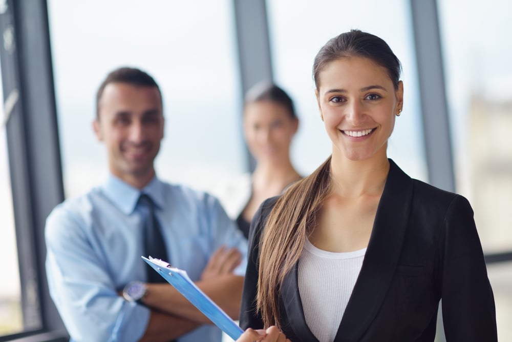 Group of happy young  business people in a meeting at office